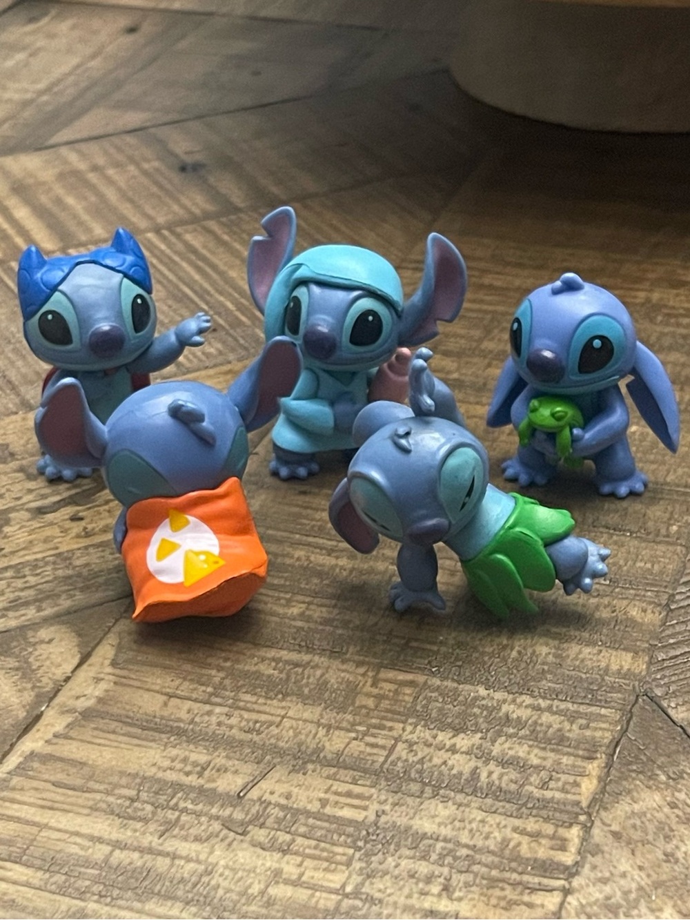 Disney Stitch mini-figurines, likely from a collectible set by Just Play